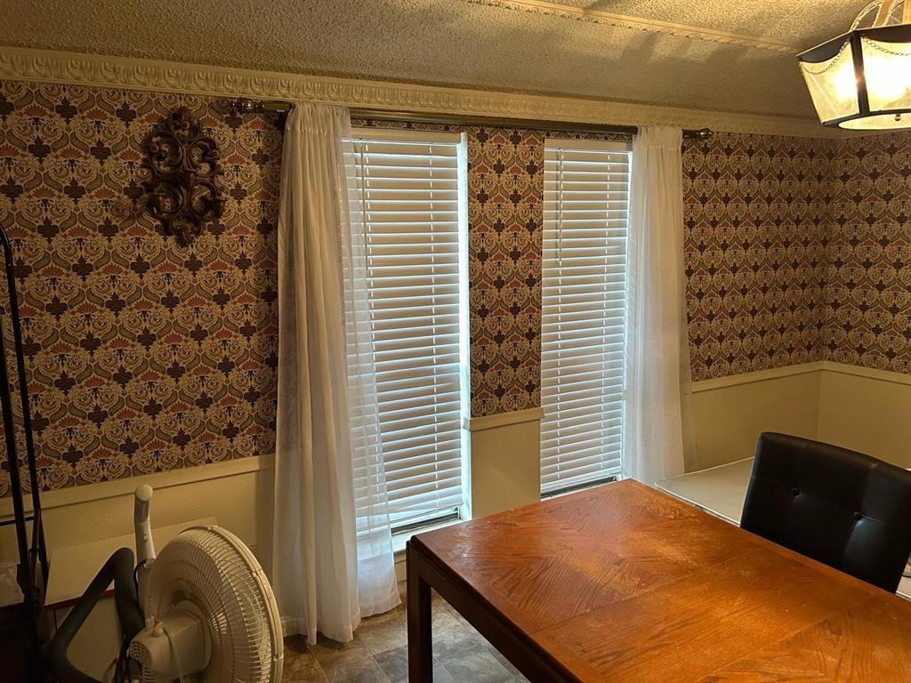 13114 Halwin Circle Dallas, TX 75243 - Photo 10 of 23 a bedroom with a bed and a window