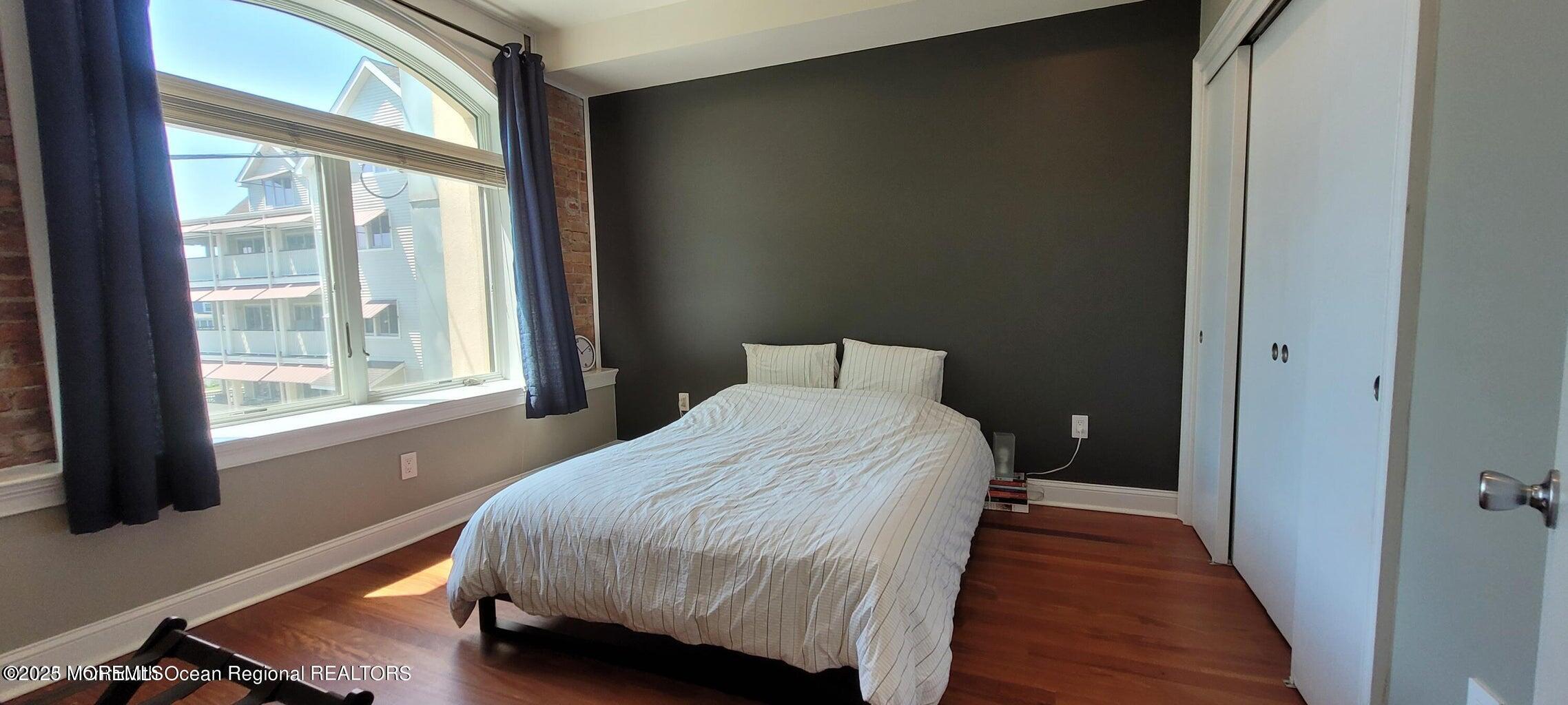 508 Cookman Avenue, Unit 204 Asbury Park, NJ 07712 - Photo 7 of 8 a bedroom with a bed and a window