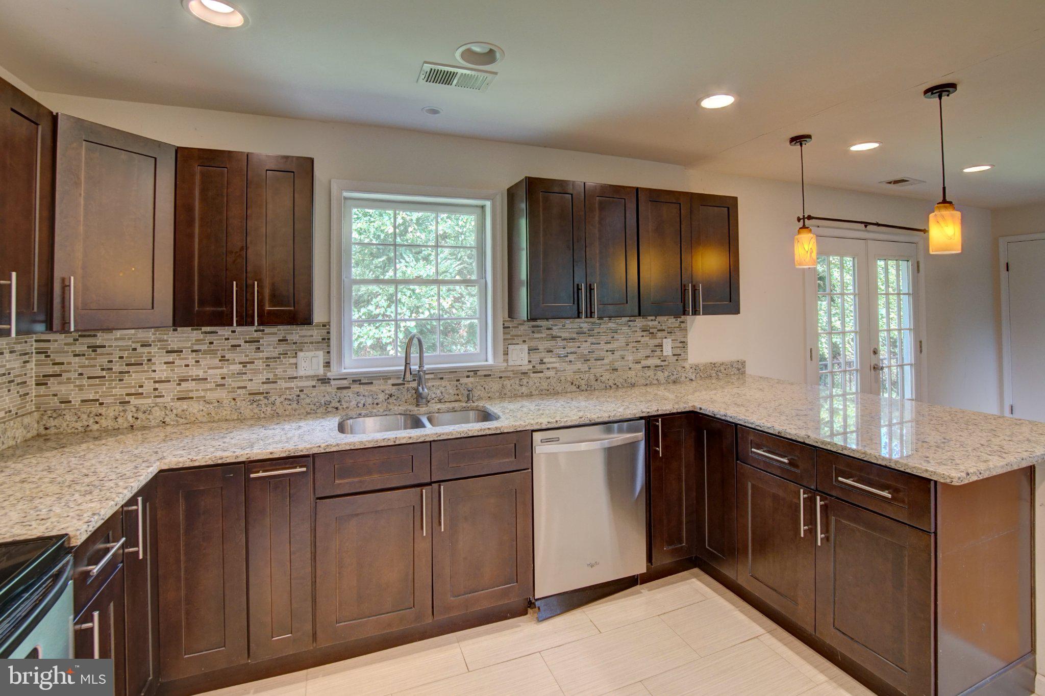 900 Walker Road Great Falls, VA 22066 - Photo 13 of 52 Modern kitchen with elegant finishes.