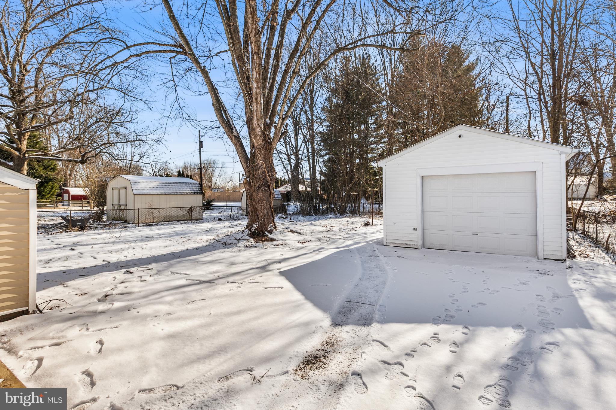 114 Brown Street Elkton, MD 21921 - Photo 12 of 15 a view of a white house with a yard covered in snow