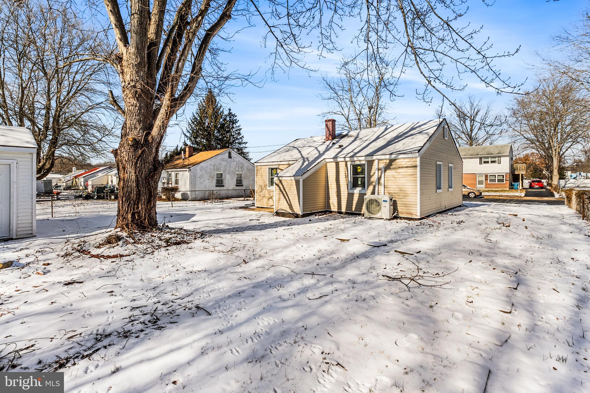 114 Brown Street Elkton, MD 21921 - Photo 15 of 15 a front view of a house with a yard covered in snow