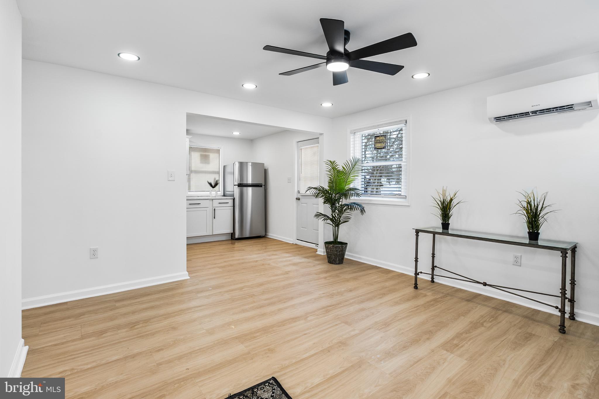 114 Brown Street Elkton, MD 21921 - Photo 5 of 15 a view of an empty room with a window and wooden floor