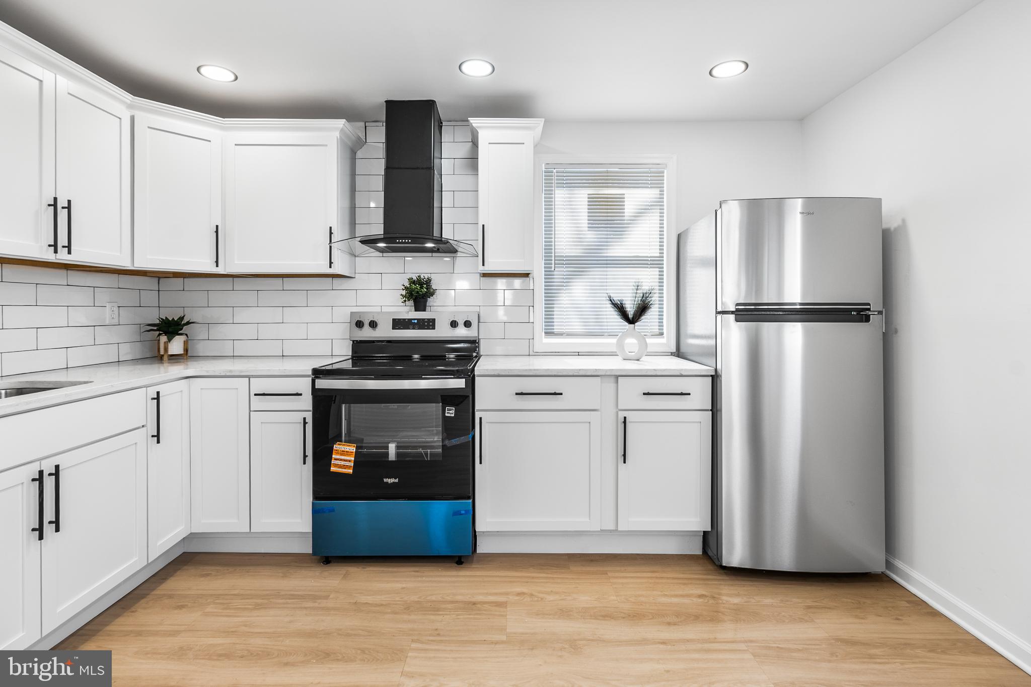 114 Brown Street Elkton, MD 21921 - Photo 6 of 15 a kitchen with stainless steel appliances a refrigerator stove and sink