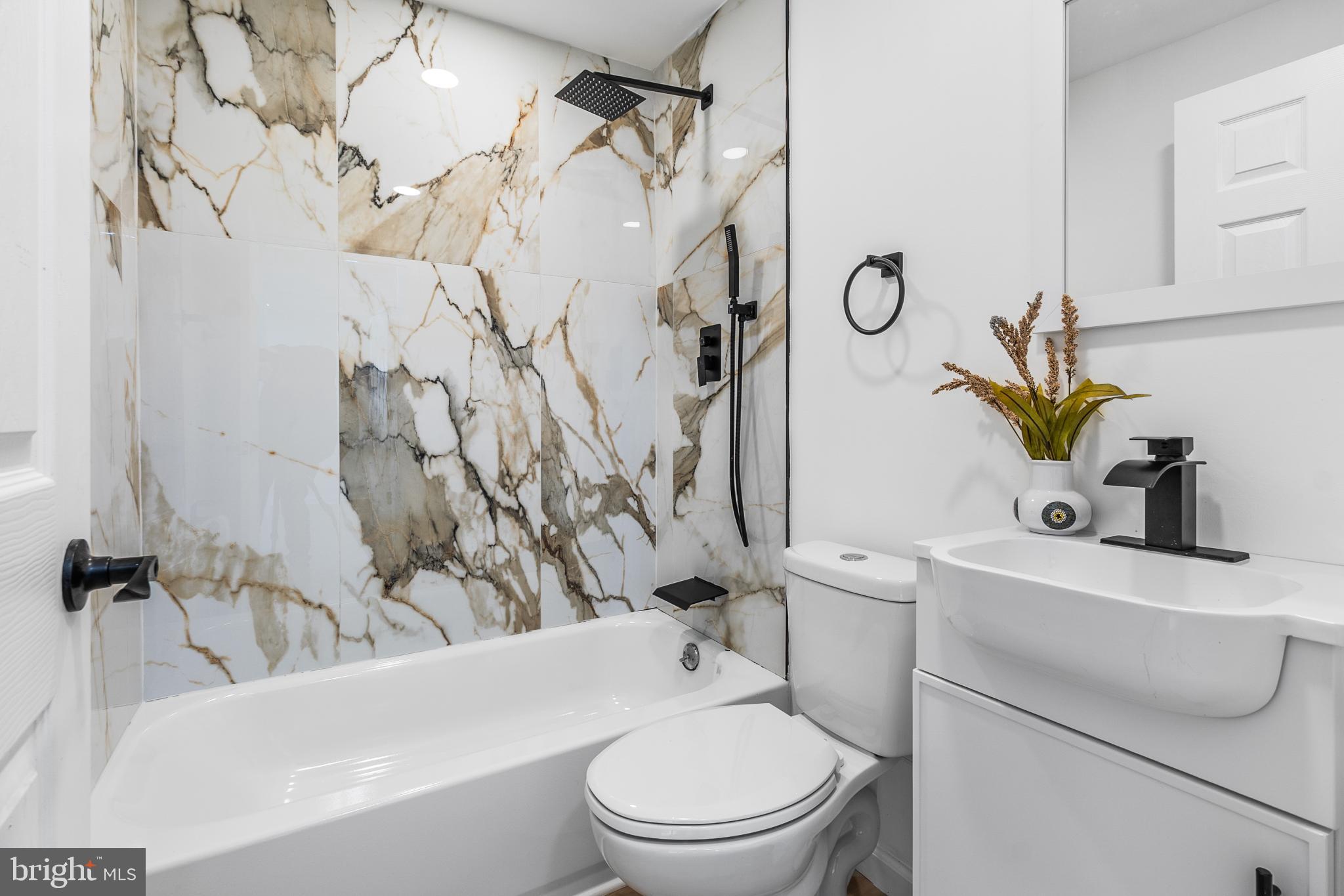 114 Brown Street Elkton, MD 21921 - Photo 10 of 15 a white toilet sitting next to a bath tub