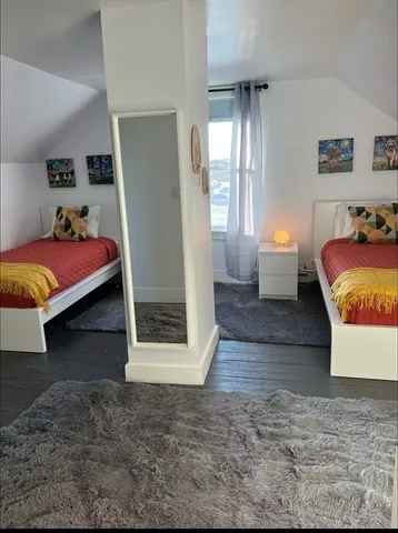a bed room with a bed and a window