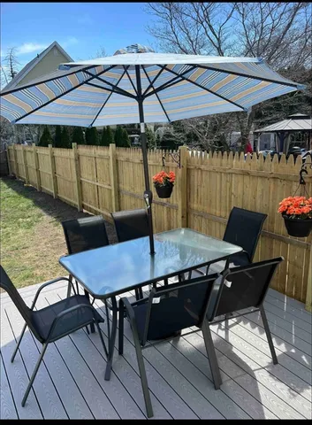 a patio with table and chairs
