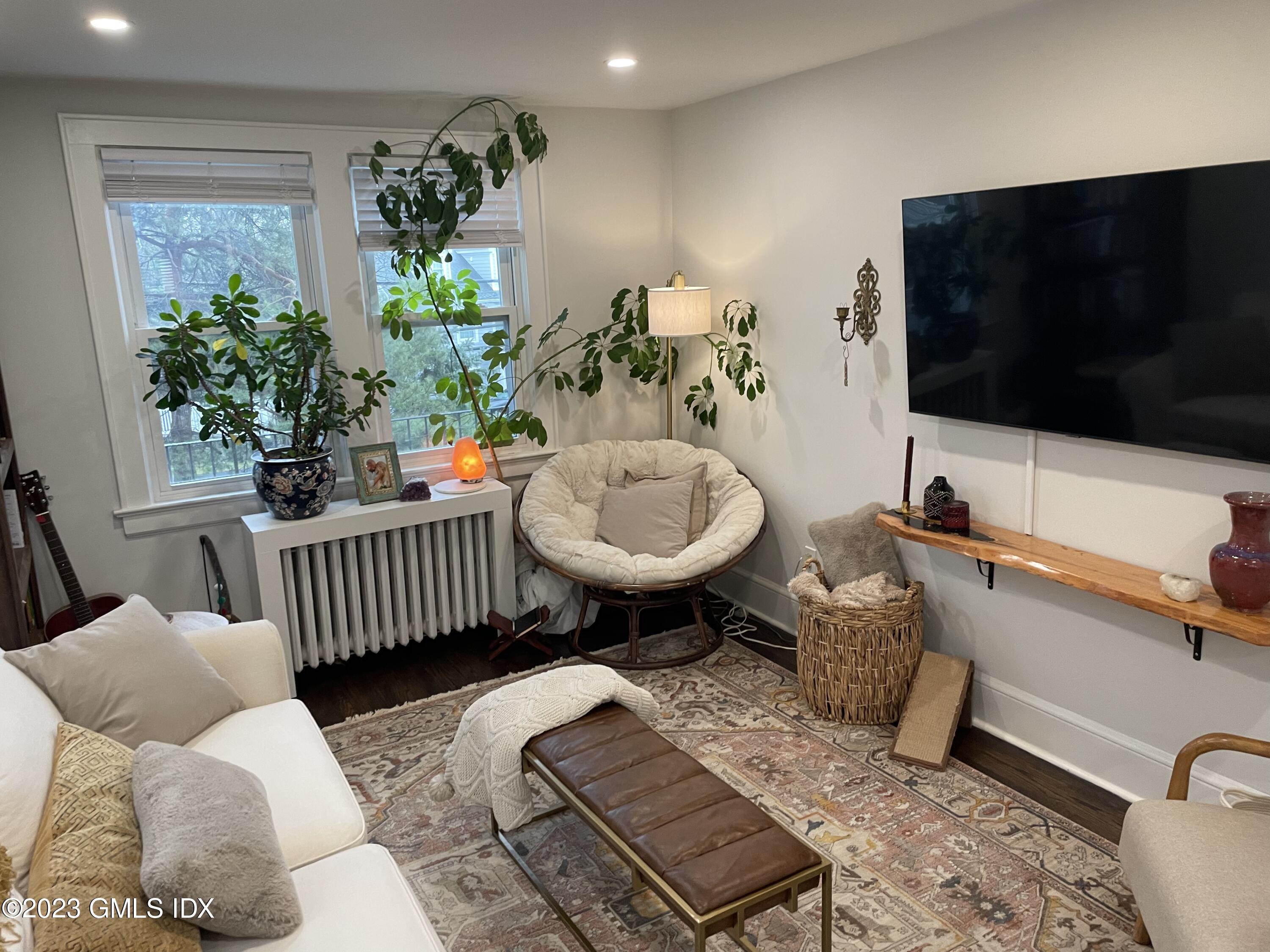60 Weaver Street, Unit 2 Greenwich, CT 06831 - Photo 10 of 20 a living room with furniture and a flat screen tv