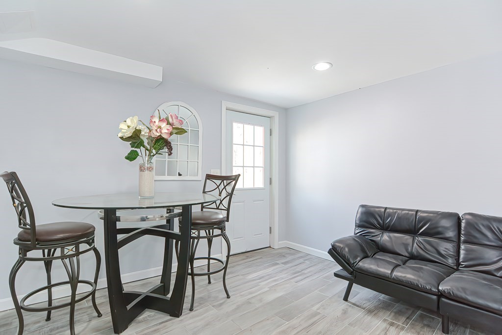 32 Siani Road Leicester, MA 01542 - Photo 26 of 37 a view of a dining room with furniture and wooden floor