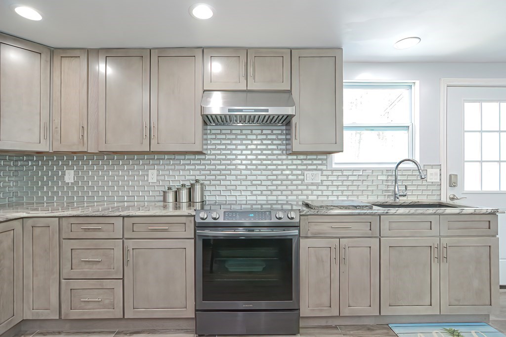 32 Siani Road Leicester, MA 01542 - Photo 8 of 37 a kitchen with cabinets appliances and a sink