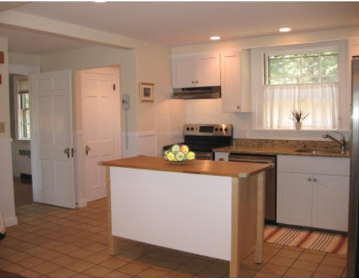 156 Thornton Road Needham, MA 02492 - Photo 5 of 12 a kitchen with granite countertop cabinets stainless steel appliances a sink and a window