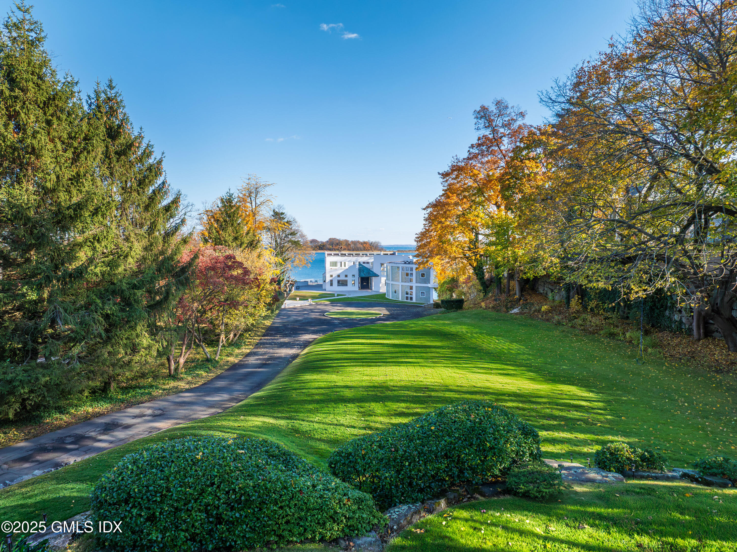 111 Byram Shore Road Greenwich, CT 06830 - Photo 22 of 23 a view of a park with large trees