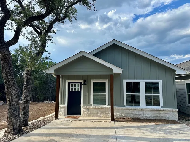 a view of a house with a tree