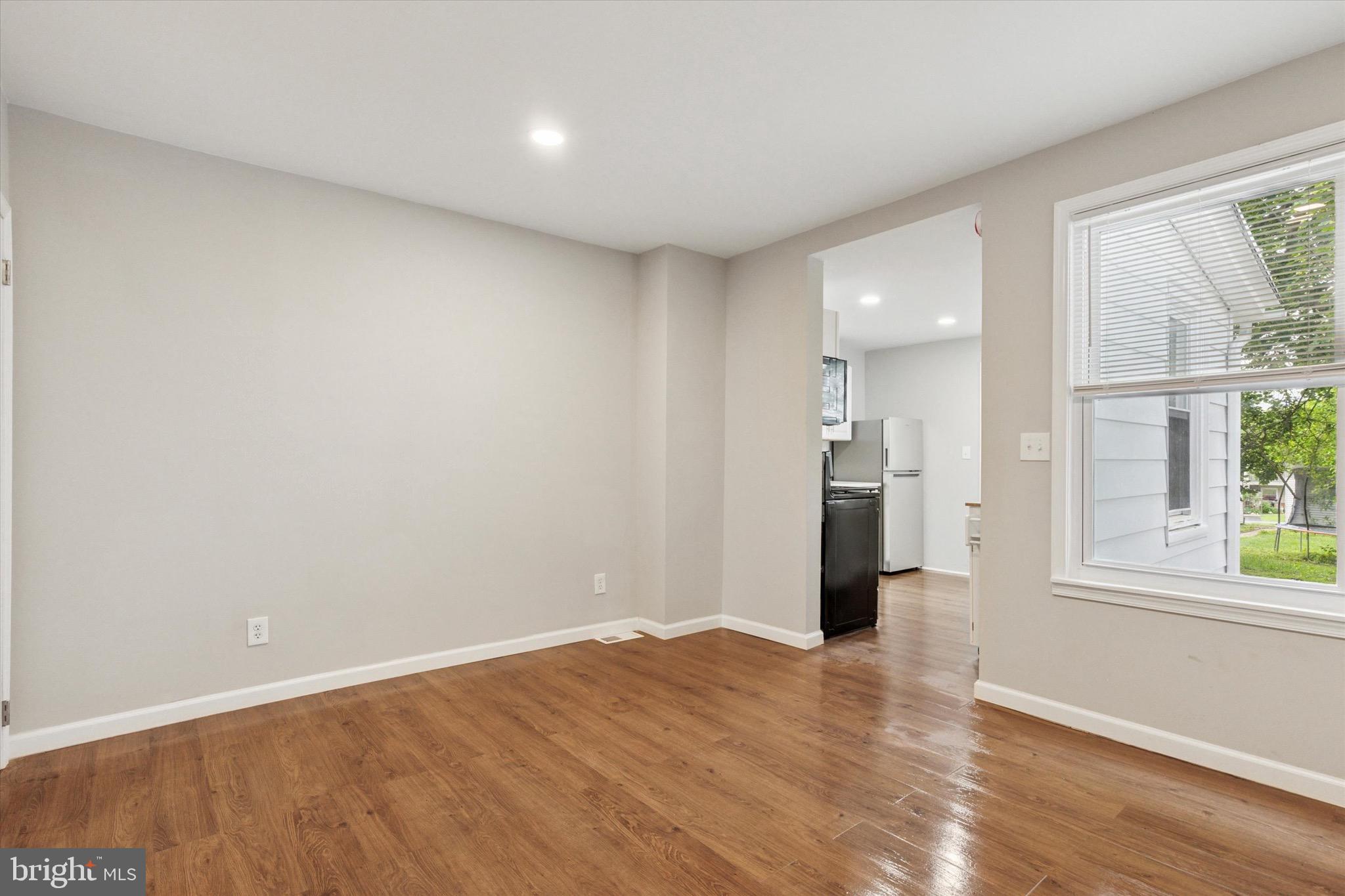 234 Main Street Hellertown, PA 18055 - Photo 5 of 13 a view of a big room with wooden floor and windows