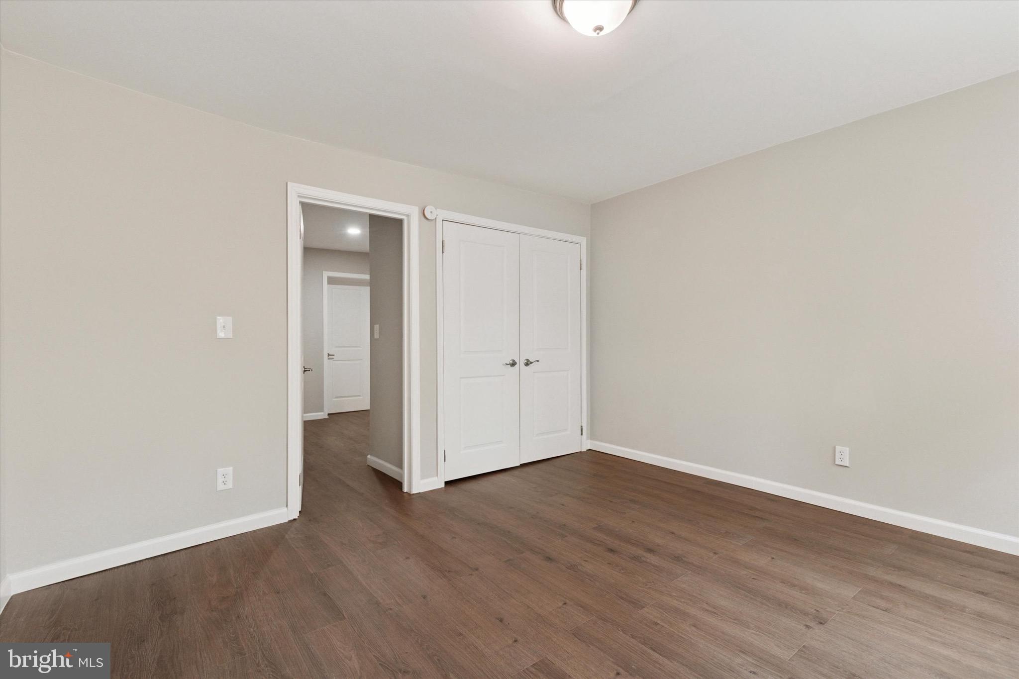 234 Main Street Hellertown, PA 18055 - Photo 10 of 13 a view of an empty room with wooden floor
