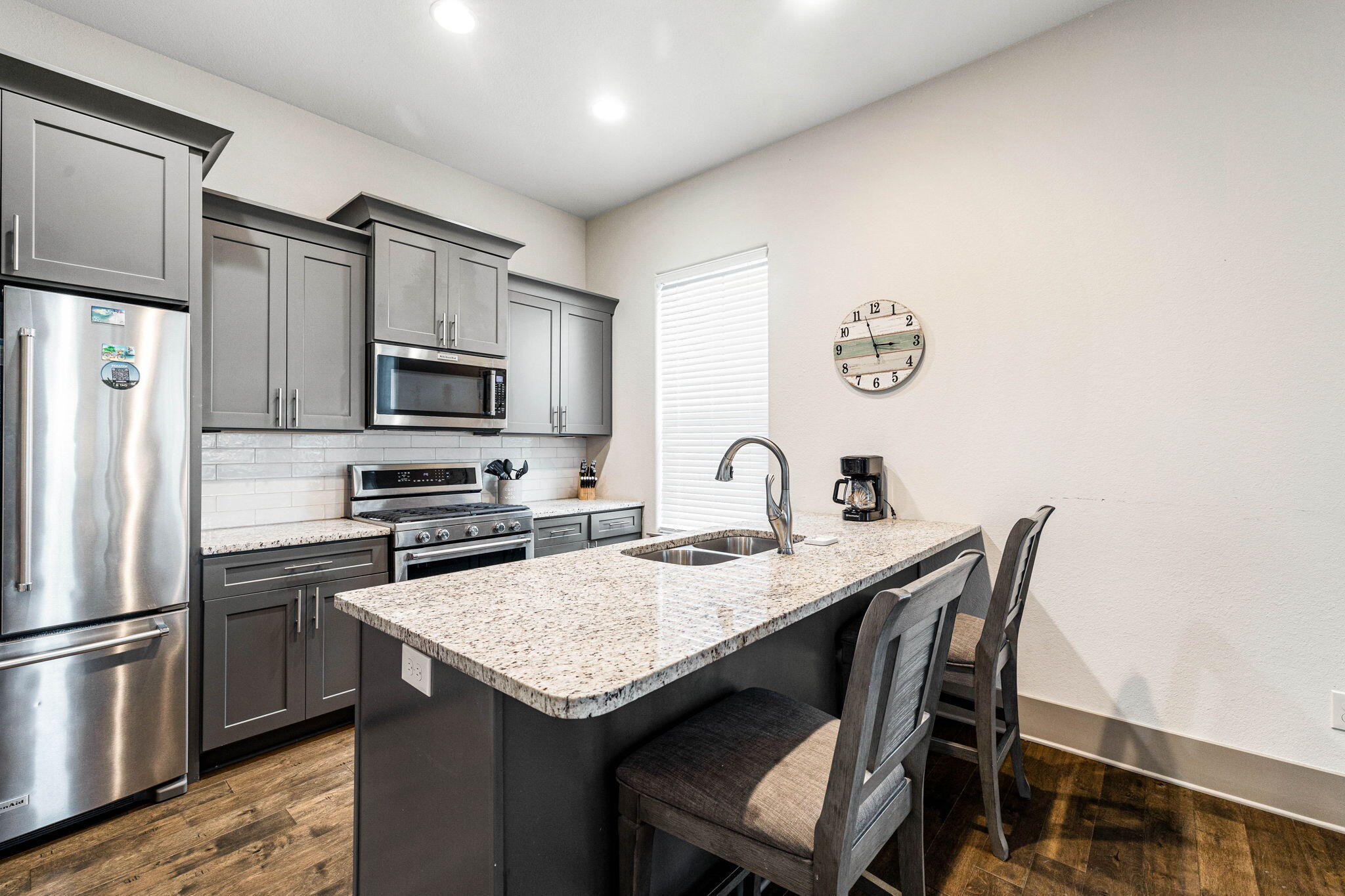 267 Gulfview Circle Santa Rosa Beach, FL 32459 - Photo 11 of 46 a kitchen with a table chairs refrigerator and microwave