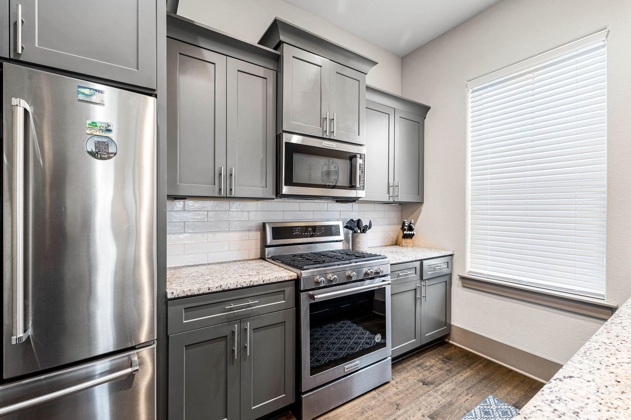 267 Gulfview Circle Santa Rosa Beach, FL 32459 - Photo 14 of 46 a kitchen with stainless steel appliances white cabinets and a stove top oven