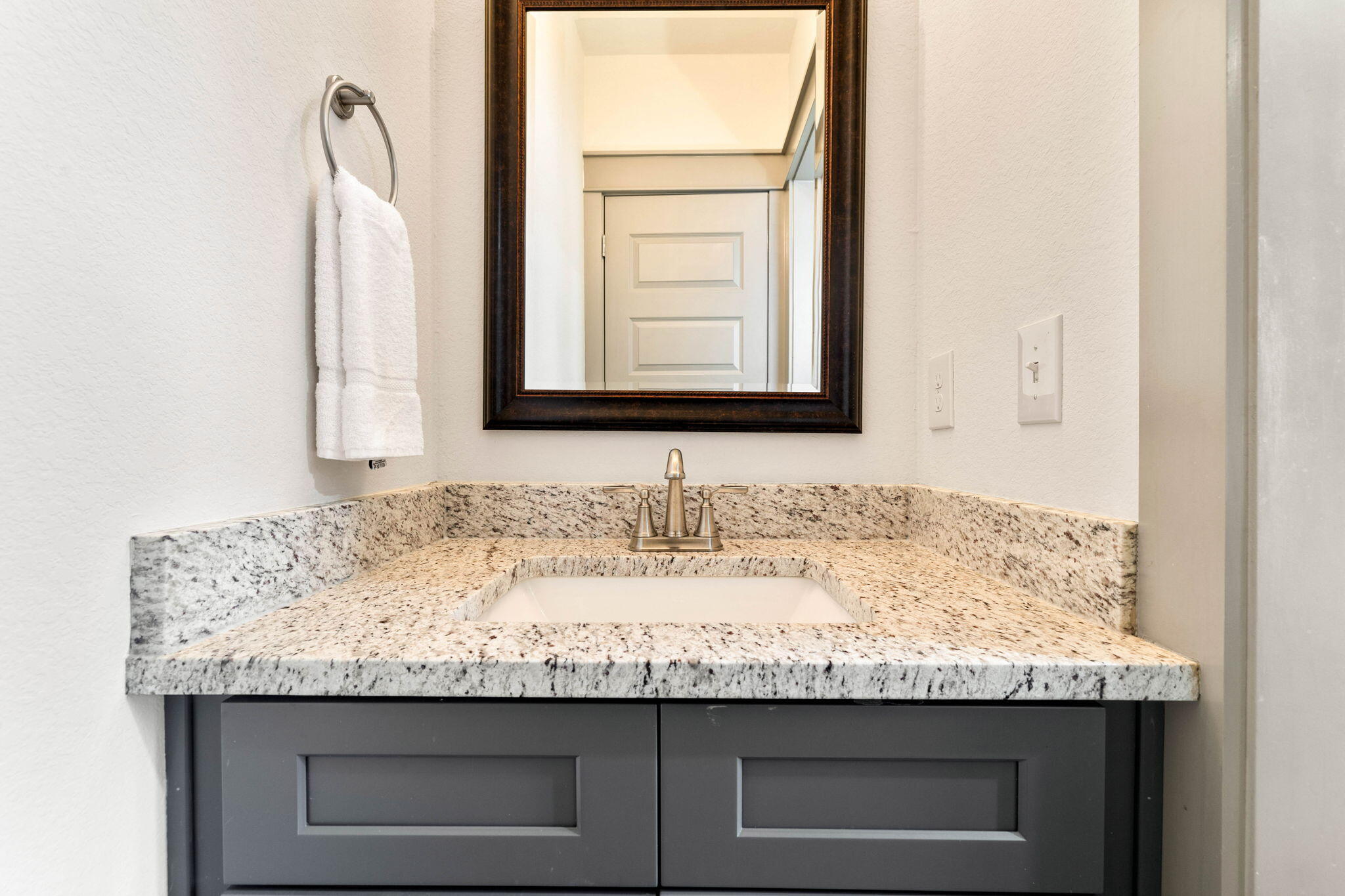 267 Gulfview Circle Santa Rosa Beach, FL 32459 - Photo 23 of 46 a bathroom with granite countertop sink and a mirror