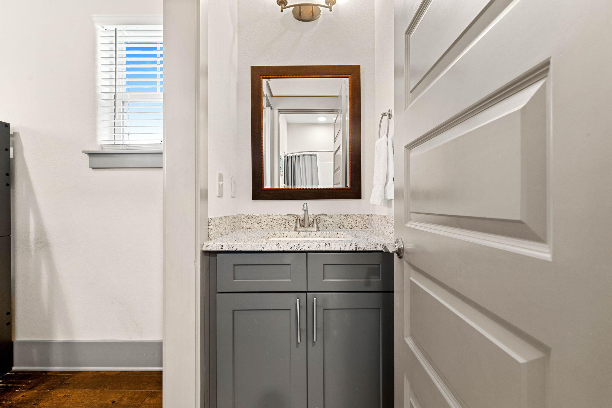 267 Gulfview Circle Santa Rosa Beach, FL 32459 - Photo 26 of 46 a bathroom with a granite countertop sink and a mirror