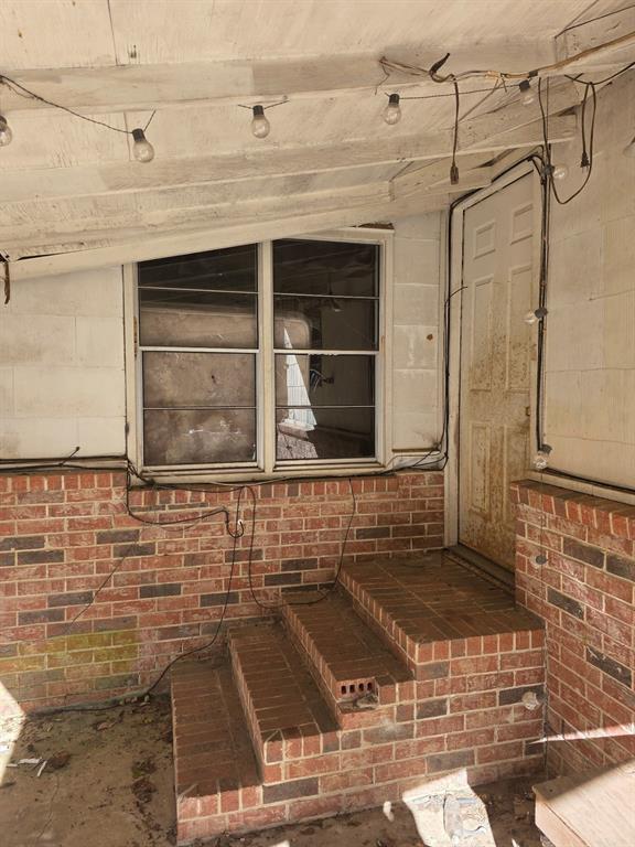 908 Burns Street Kilgore, TX 75662 - Photo 7 of 20 a view of a door and a window
