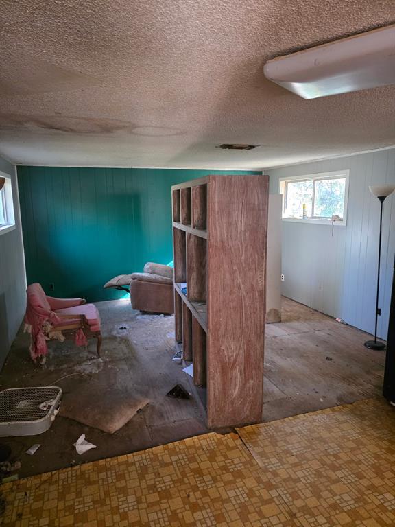 908 Burns Street Kilgore, TX 75662 - Photo 8 of 20 a living room with furniture and a flat screen tv