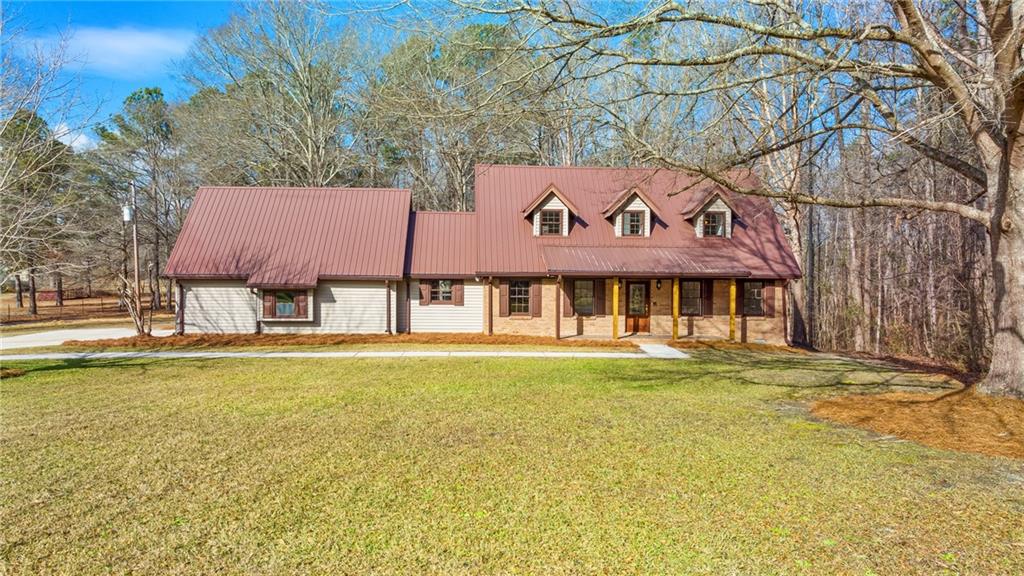 406 Mayfield Road Dallas, GA 30157 - Photo 1 of 1 a front view of a house with swimming pool