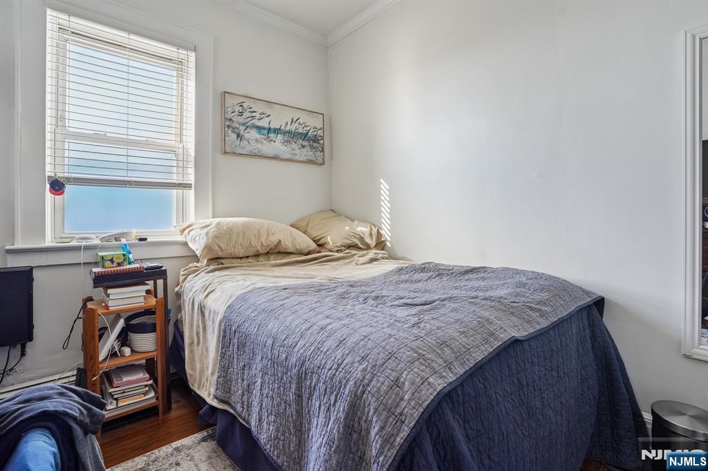 82 Hackensack Street, Unit 6 Wood-Ridge, NJ 07075 - Photo 14 of 28 a bedroom with a bed and a window