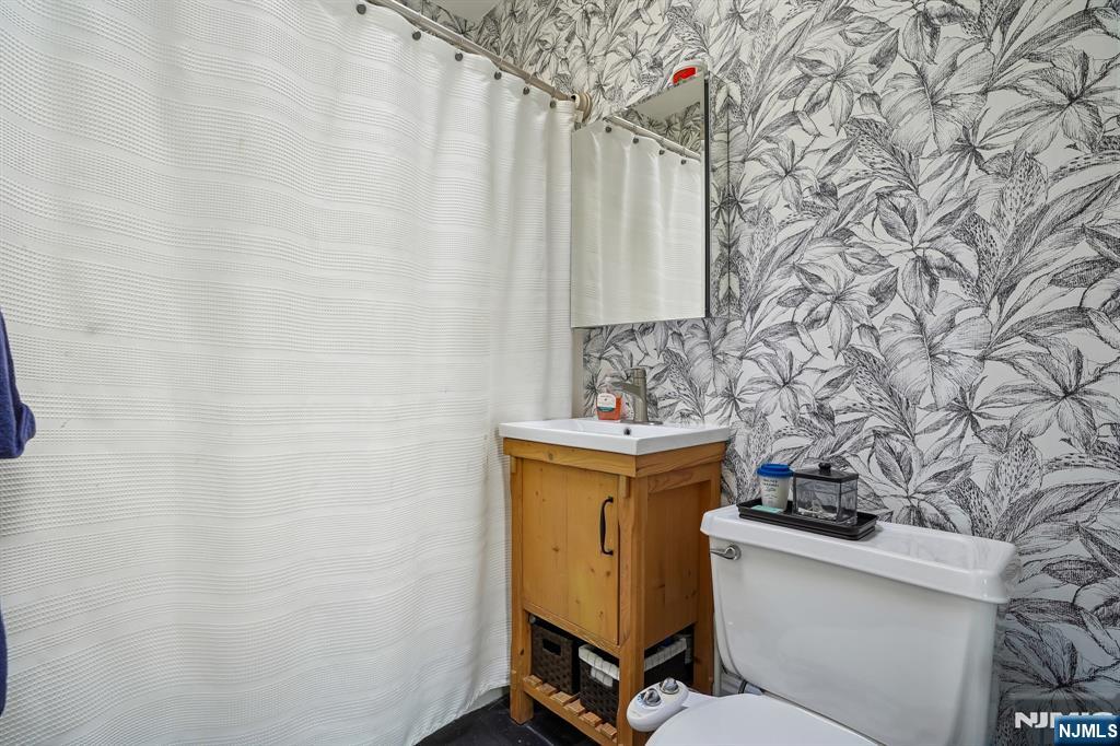 82 Hackensack Street, Unit 6 Wood-Ridge, NJ 07075 - Photo 16 of 28 a bathroom with a sink and a toilet
