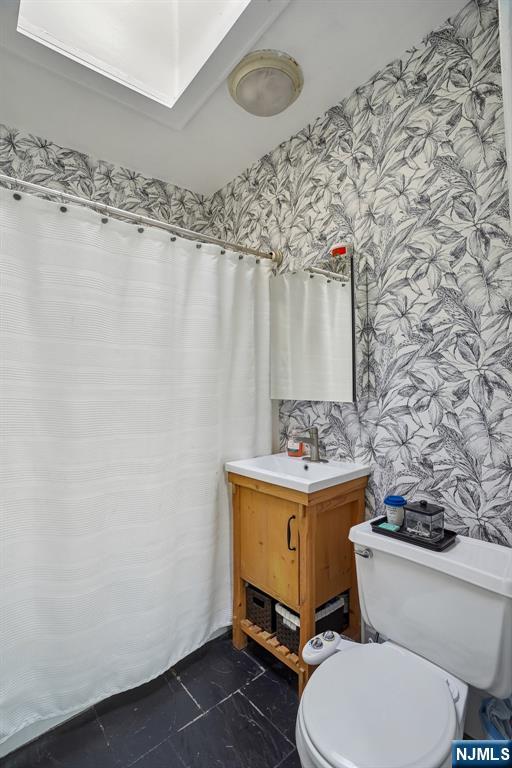 82 Hackensack Street, Unit 6 Wood-Ridge, NJ 07075 - Photo 17 of 28 a bathroom with a toilet and a sink
