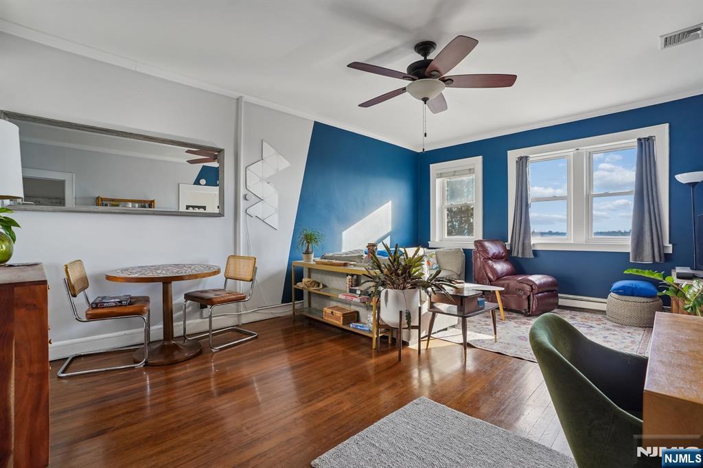 82 Hackensack Street, Unit 6 Wood-Ridge, NJ 07075 - Photo 2 of 28 a living room with furniture and a large window