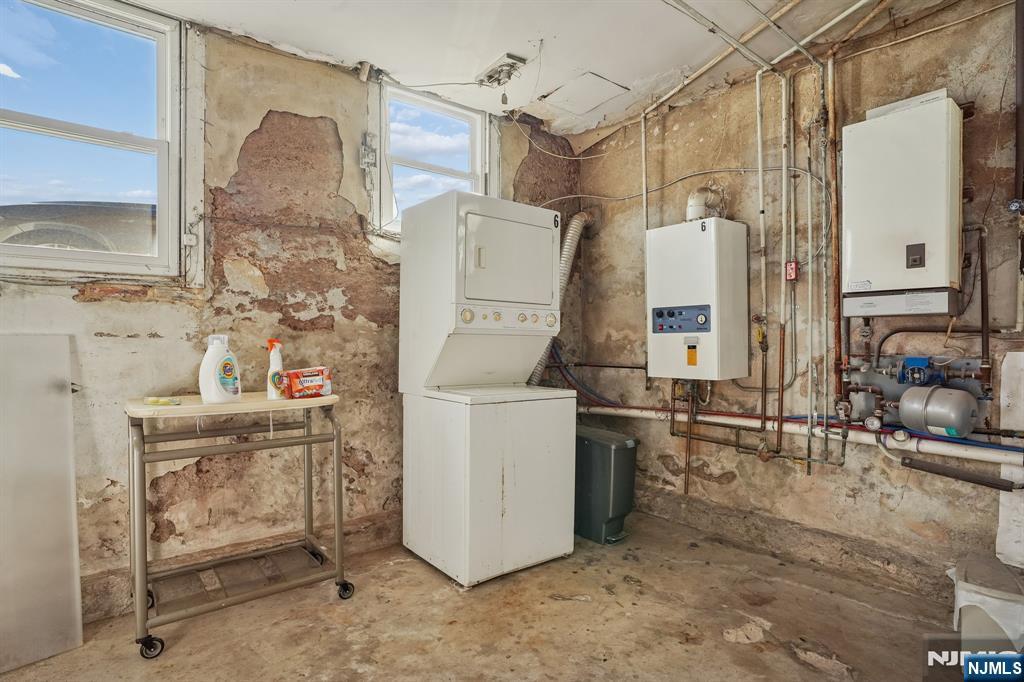 82 Hackensack Street, Unit 6 Wood-Ridge, NJ 07075 - Photo 21 of 28 a bathroom with a sink a mirror and a shower