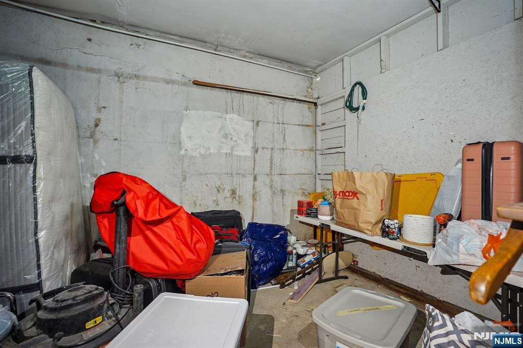 82 Hackensack Street, Unit 6 Wood-Ridge, NJ 07075 - Photo 23 of 28 a bathroom with a sink mirror and toilet