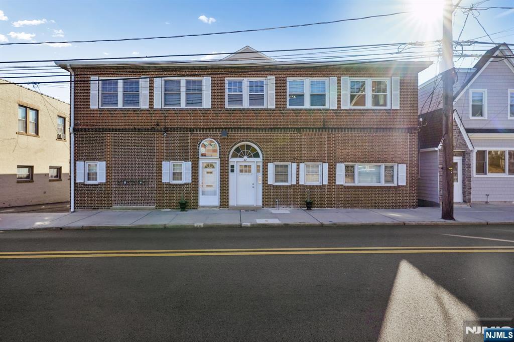 82 Hackensack Street, Unit 6 Wood-Ridge, NJ 07075 - Photo 27 of 28 a front view of building with yard