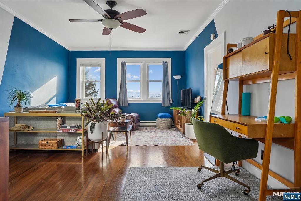 82 Hackensack Street, Unit 6 Wood-Ridge, NJ 07075 - Photo 5 of 28 a living room with furniture and wooden floor
