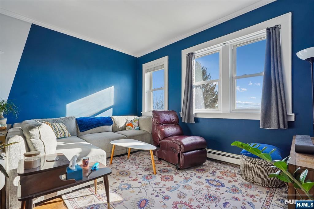 82 Hackensack Street, Unit 6 Wood-Ridge, NJ 07075 - Photo 7 of 28 a living room with furniture and a window