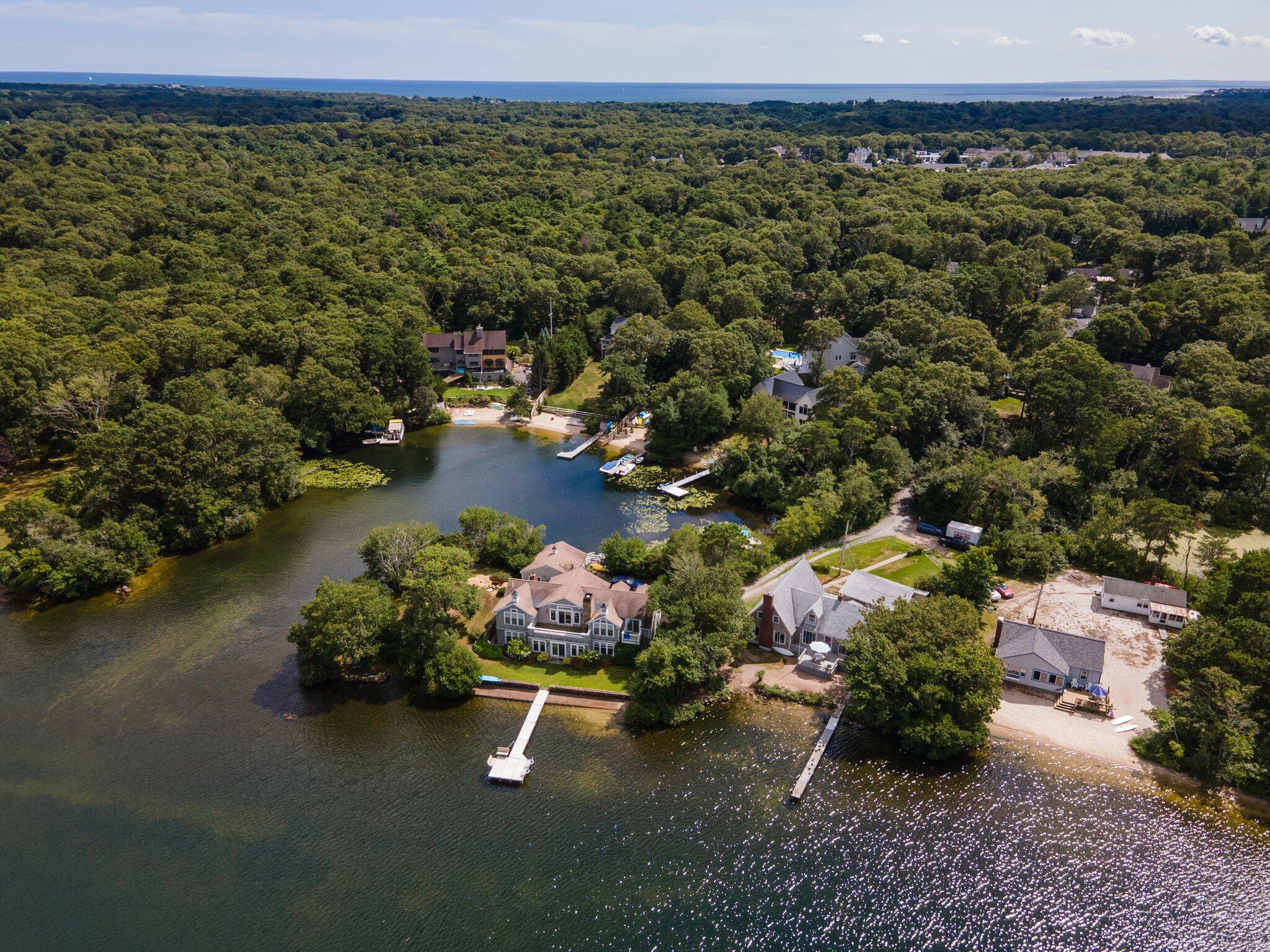 159 Willow Run Drive Centerville, MA 02632 - Photo 2 of 34 a view of a lake with a mountain view