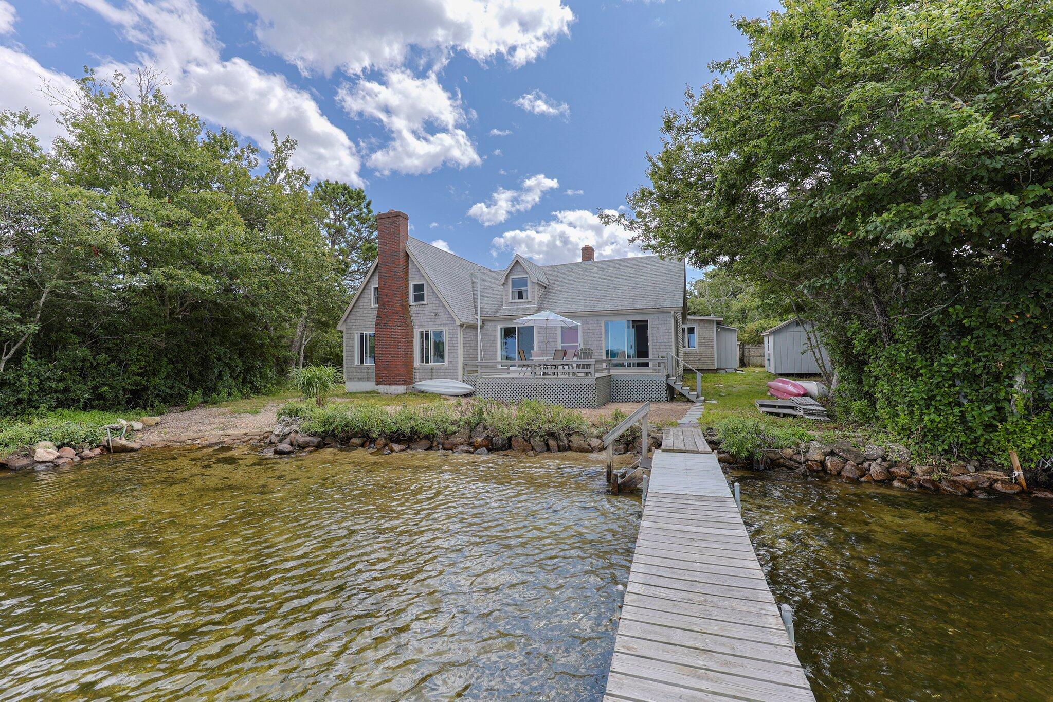 159 Willow Run Drive Centerville, MA 02632 - Photo 6 of 34 a front view of a house with a yard