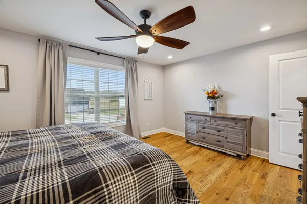 a bedroom with a bed and a dresser