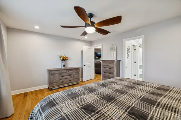 a bed room with a bed and a chandelier
