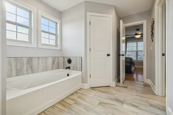 a bathroom with a bathtub and a shower