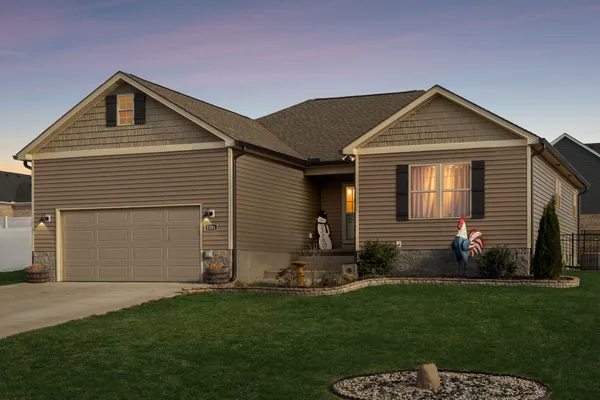 a front view of a house with a yard