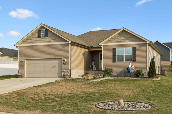 a front view of a house with a yard