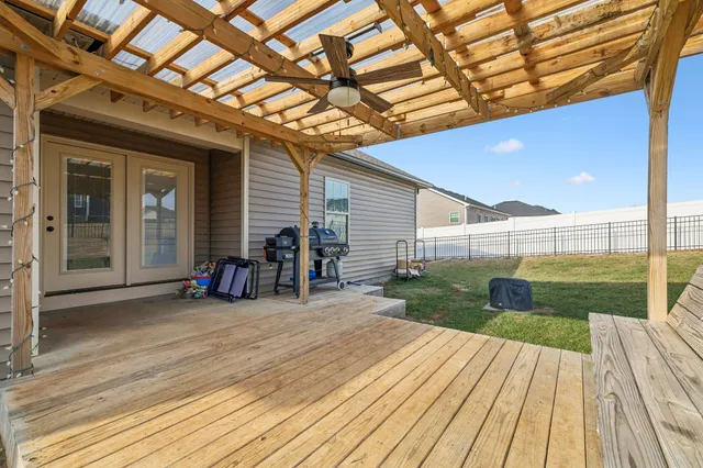 a view of a house with backyard and porch