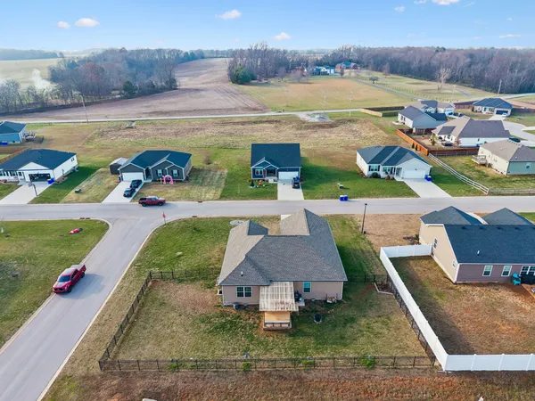 an aerial view of a house with outdoor space