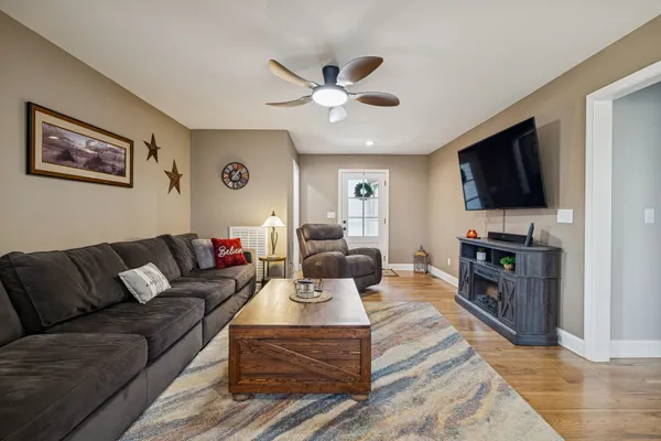 a living room with furniture and a flat screen tv