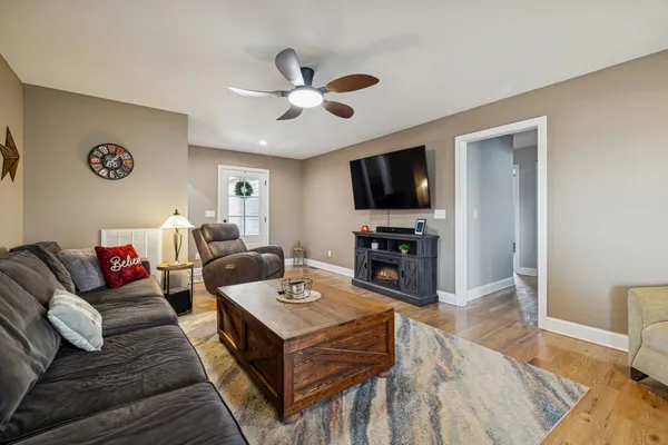 a living room with furniture and a flat screen tv