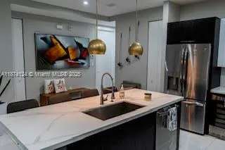 a kitchen with a table and chairs in it