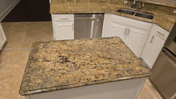 a view of a small space with wooden floor and a window
