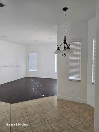 a bathroom with a granite countertop sink a toilet and bathtub