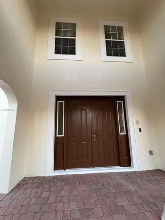 a view of a livingroom with wooden floor and a window