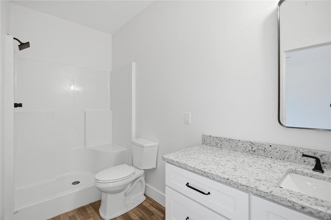 115 Riley Street Westminster, SC 29693 - Photo 15 of 46 This clean and bright bathroom features a functional vanity and a spacious shower.